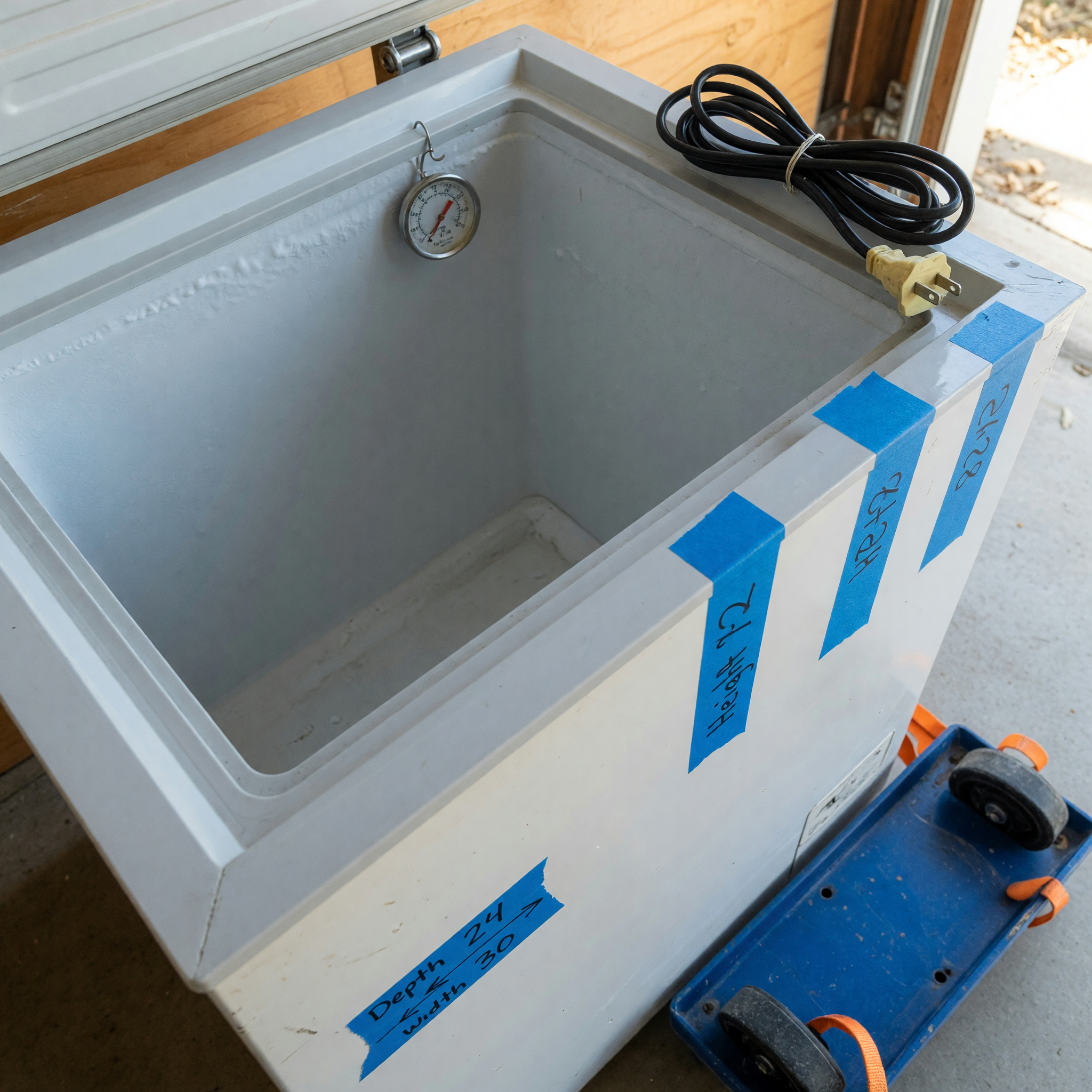 Used freezer listing preparation with thermometer, measurements, gasket, cord, and pickup dolly